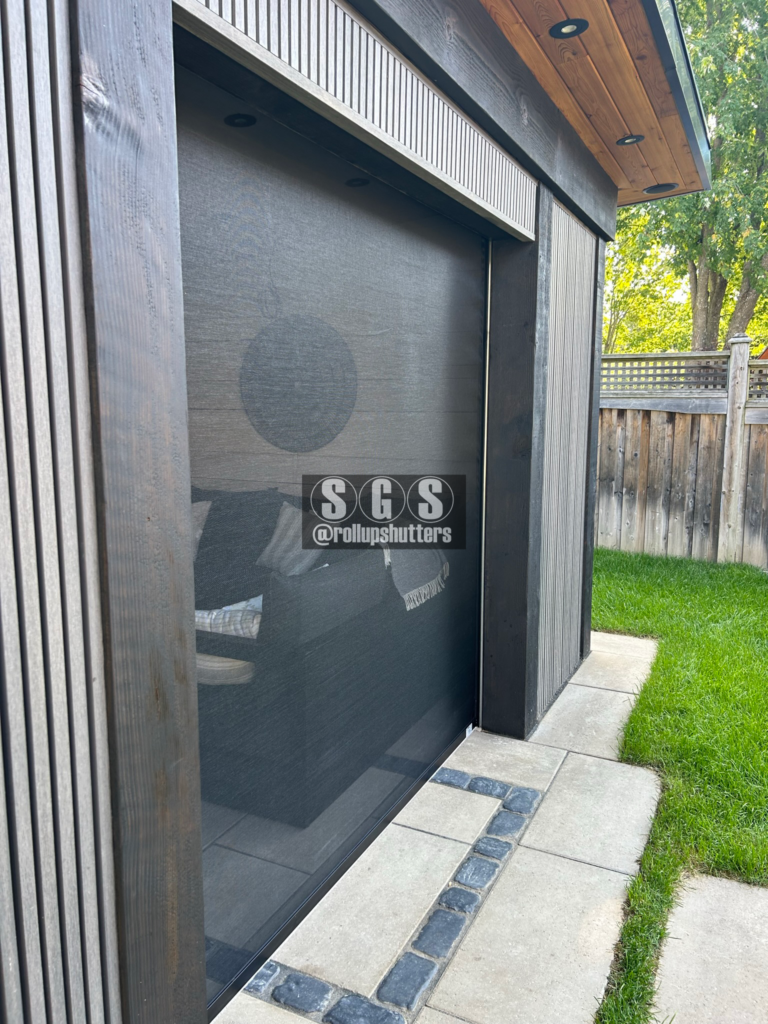 Close-up of mesh privacy screen with roll shutter track – Oakville