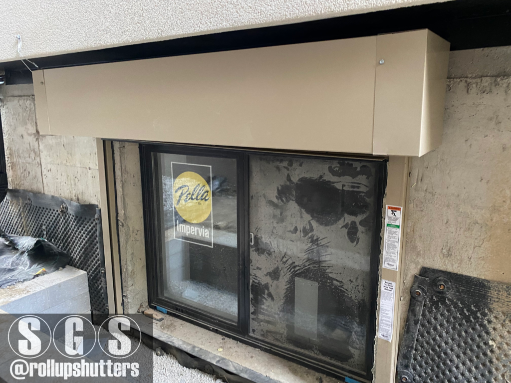 Front view of fire shutter on basement window in Vaughan