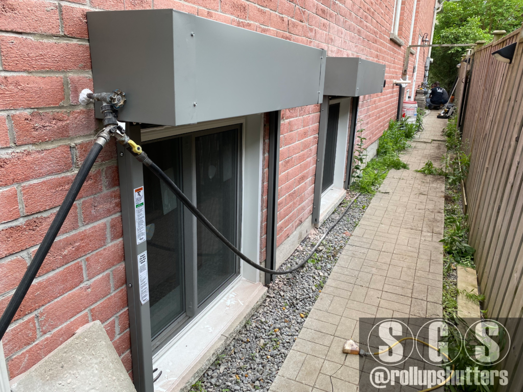Two fire-rated shutters installed on basement windows in Scarborough home